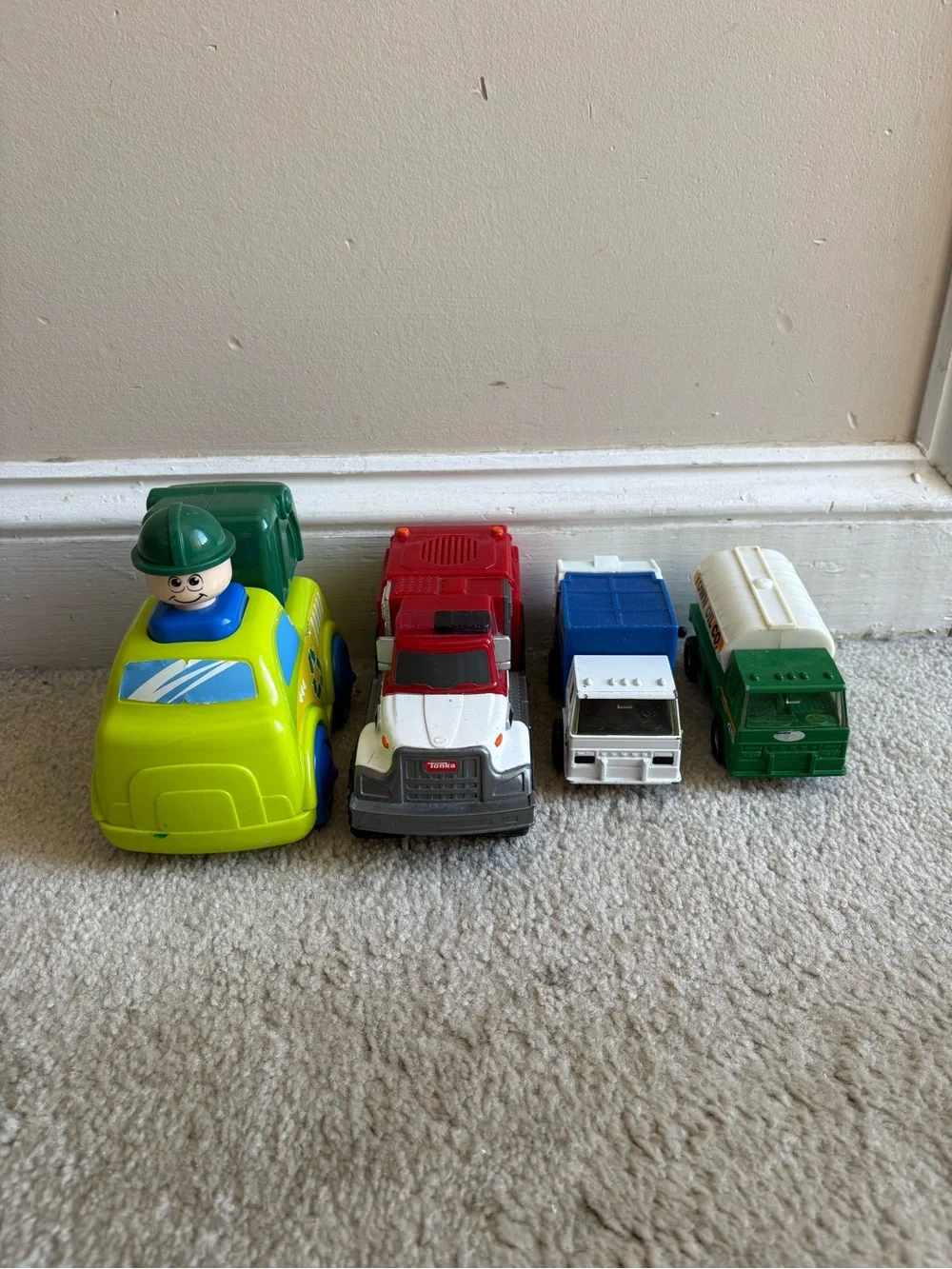 Lot of 4 play trucks for toddlers
